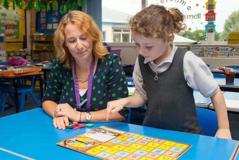 A teacher helping a student