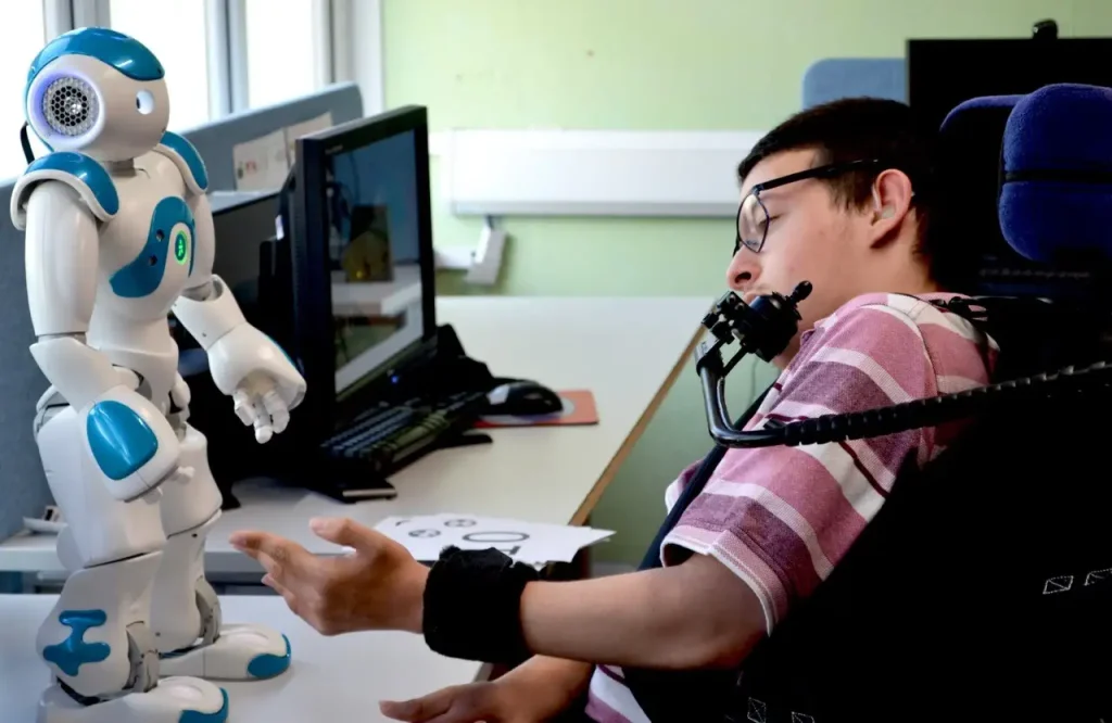 a picture of a young person interacting with a robot