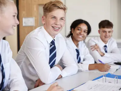 A picture of students in uniforms smiling