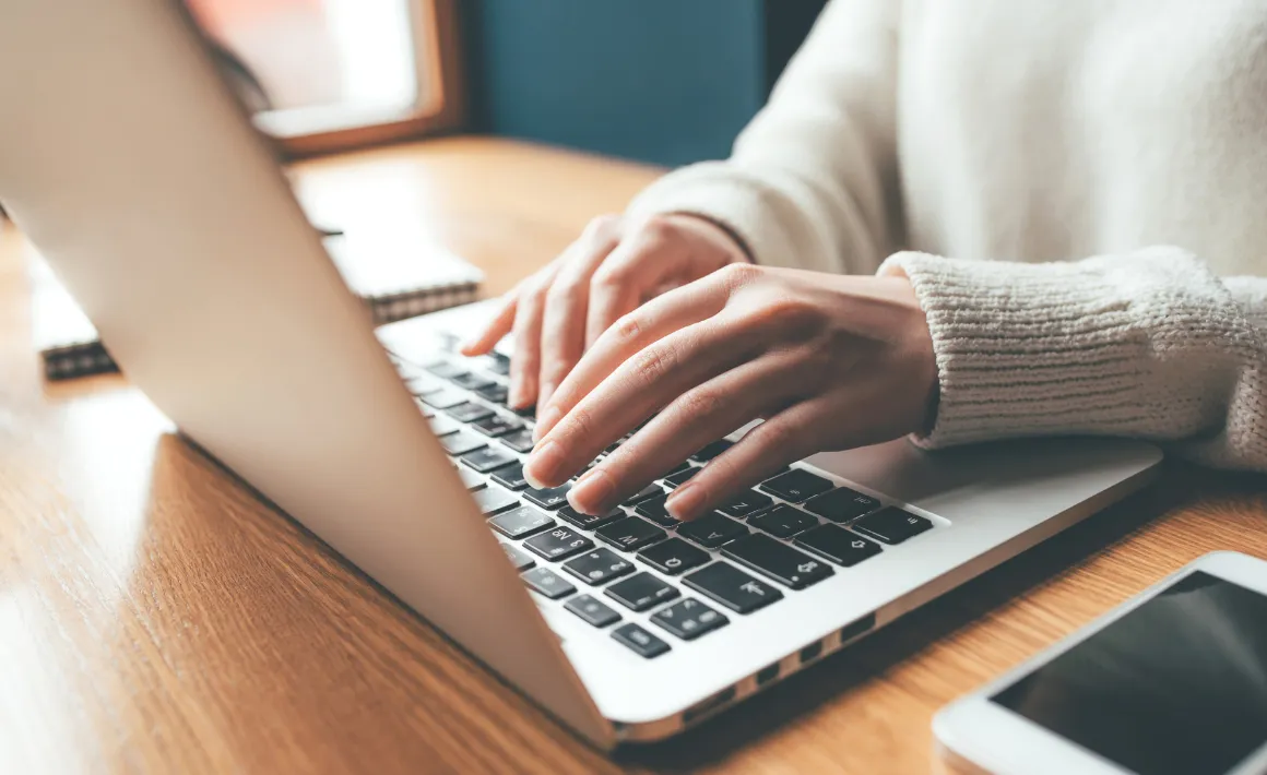 A SENCo filling in an EHCNA application on her laptop