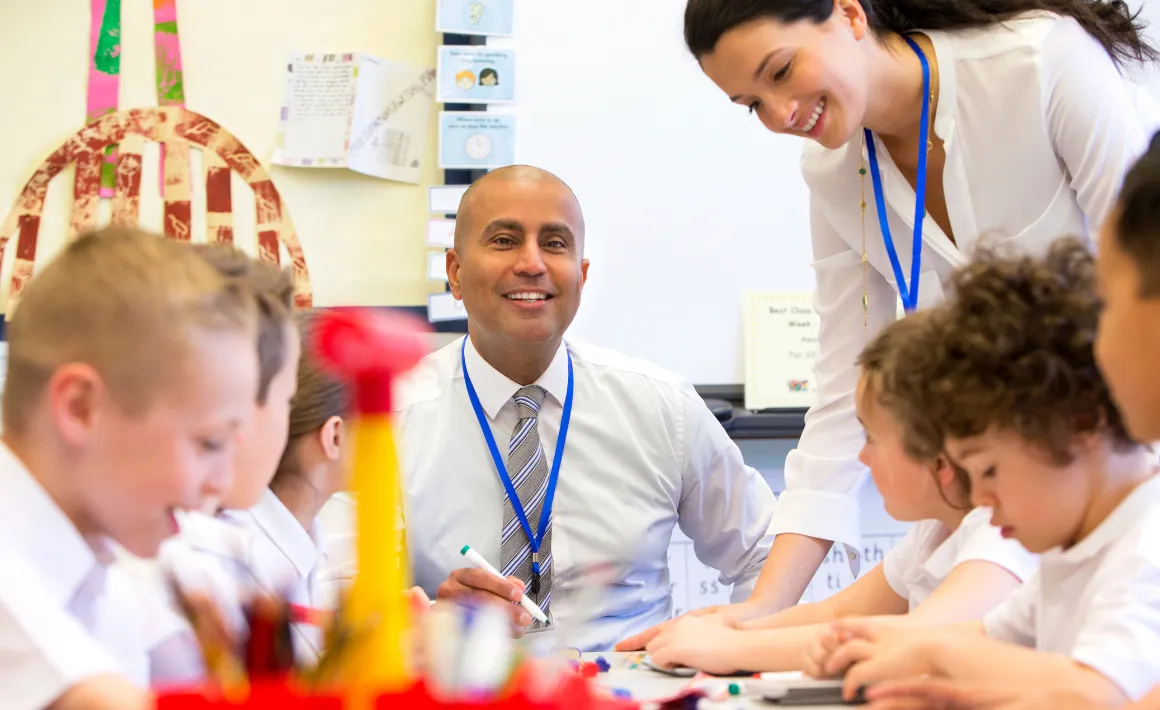 a group of school children sitting all together in class