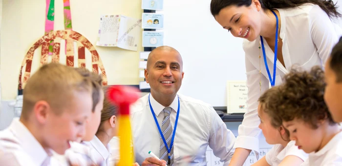 a group of pupils all together in a classroom